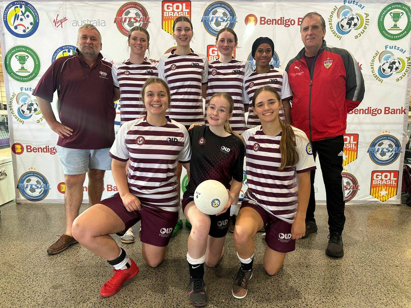 The team with their coaches after a tournament
